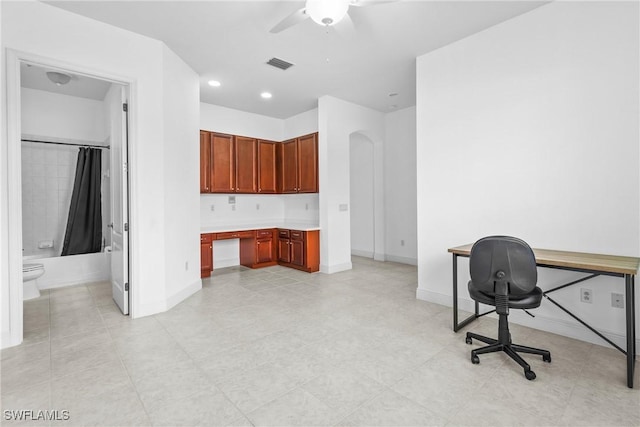 office space featuring baseboards, visible vents, a ceiling fan, built in desk, and recessed lighting