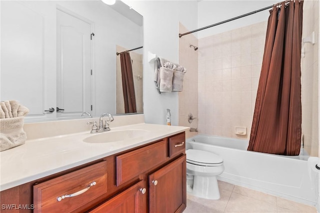 bathroom featuring toilet, tile patterned flooring, shower / bath combo, and vanity