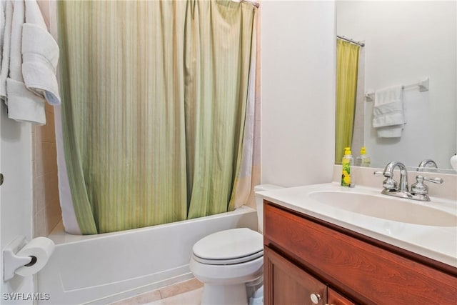 full bathroom featuring toilet, tile patterned floors, vanity, and shower / tub combo with curtain