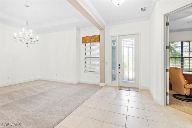 foyer featuring baseboards, visible vents, light colored carpet, crown molding, and light tile patterned flooring