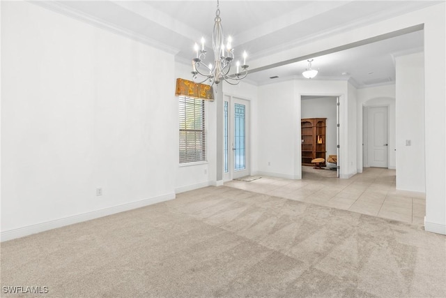 spare room featuring arched walkways, light tile patterned flooring, light carpet, baseboards, and ornamental molding