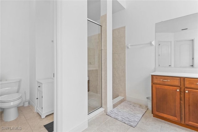 bathroom with vanity, tile patterned flooring, a shower stall, and toilet