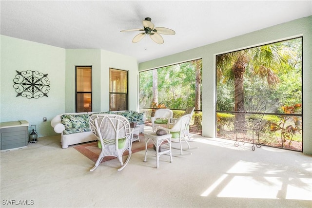 sunroom featuring ceiling fan and heating unit