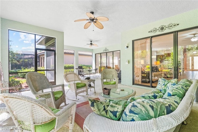 sunroom with a ceiling fan