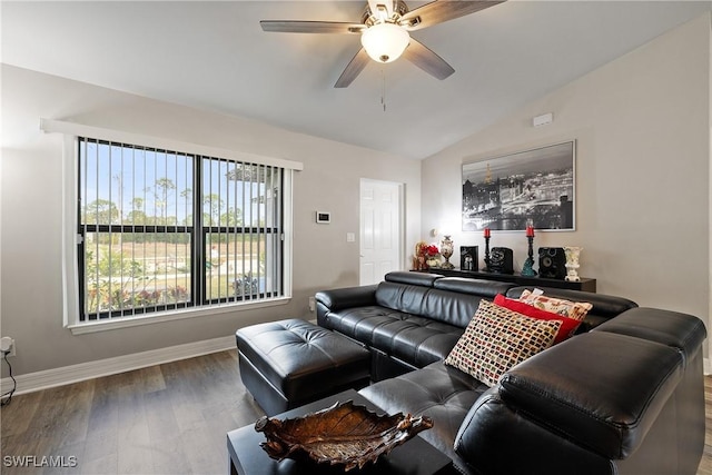 living room with hardwood / wood-style flooring, vaulted ceiling, and ceiling fan