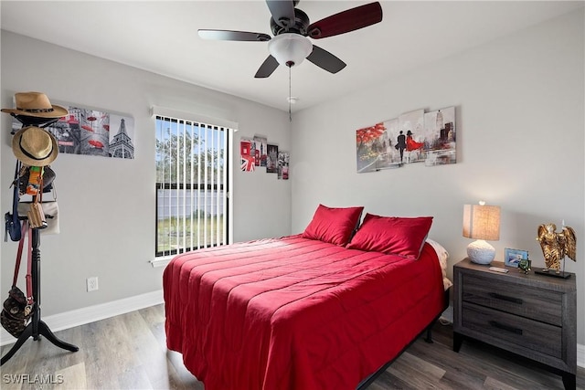 bedroom featuring hardwood / wood-style flooring and ceiling fan