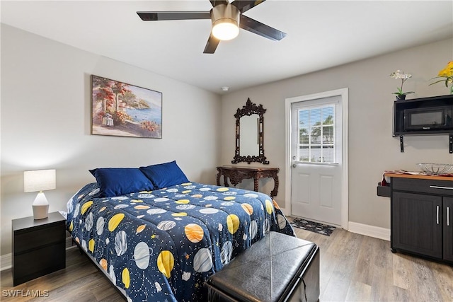 bedroom with hardwood / wood-style flooring and ceiling fan