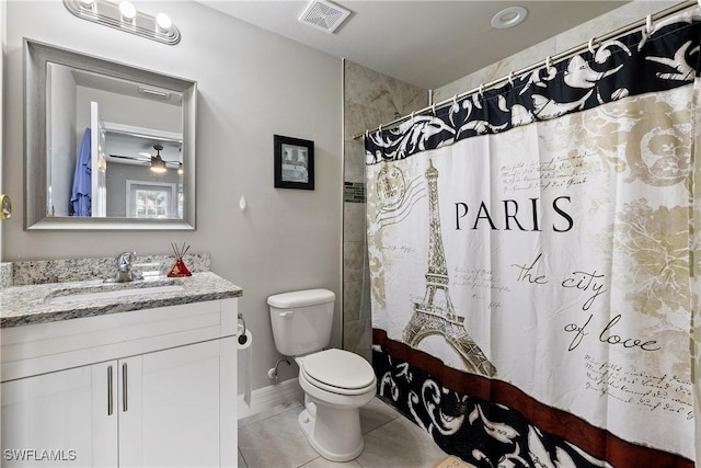 bathroom with tile patterned flooring, vanity, curtained shower, and toilet