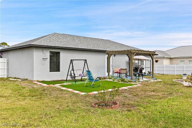 rear view of property featuring a patio, a lawn, and a pergola