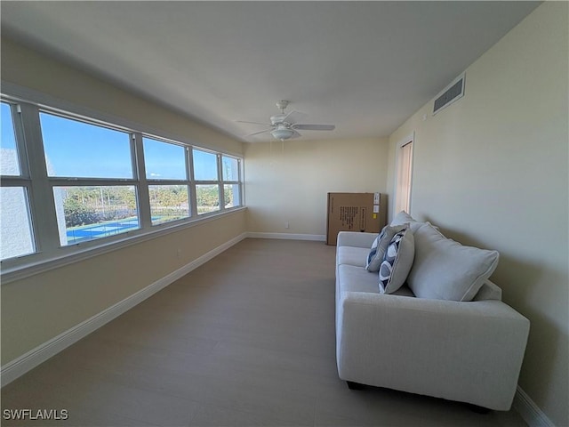 unfurnished room with hardwood / wood-style flooring and ceiling fan