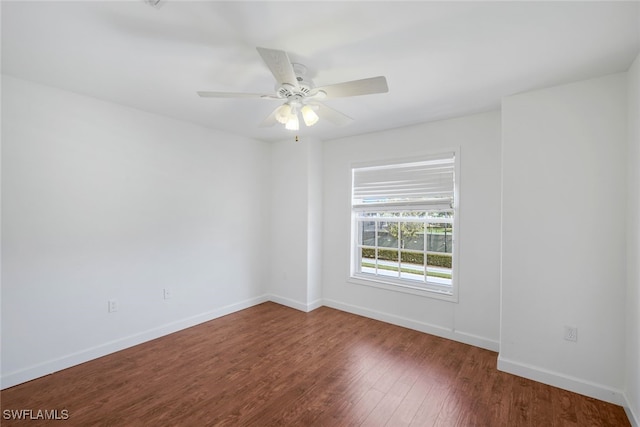 spare room featuring hardwood / wood-style floors and ceiling fan