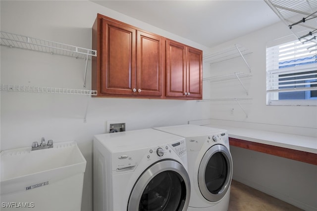 washroom with washer and dryer, sink, light tile patterned floors, and cabinets