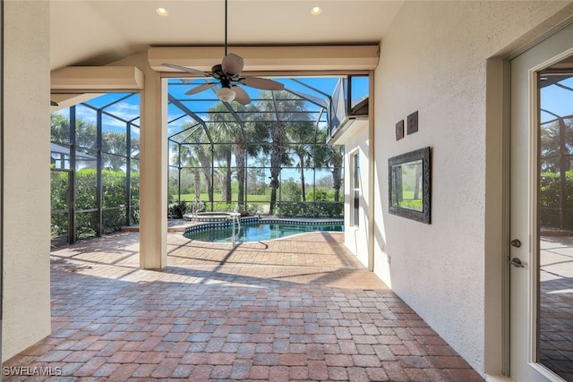 view of pool with a lanai and a patio