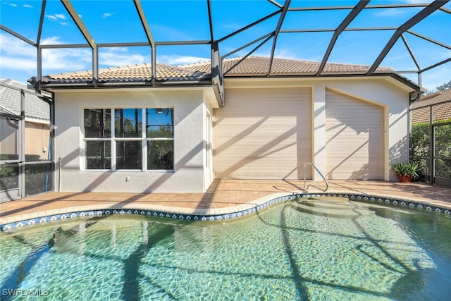 view of pool featuring a lanai and a patio