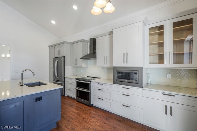 kitchen featuring sink, light stone counters, stainless steel appliances, crown molding, and wall chimney range hood