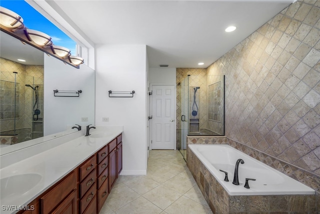 bathroom with tile patterned floors, vanity, and independent shower and bath