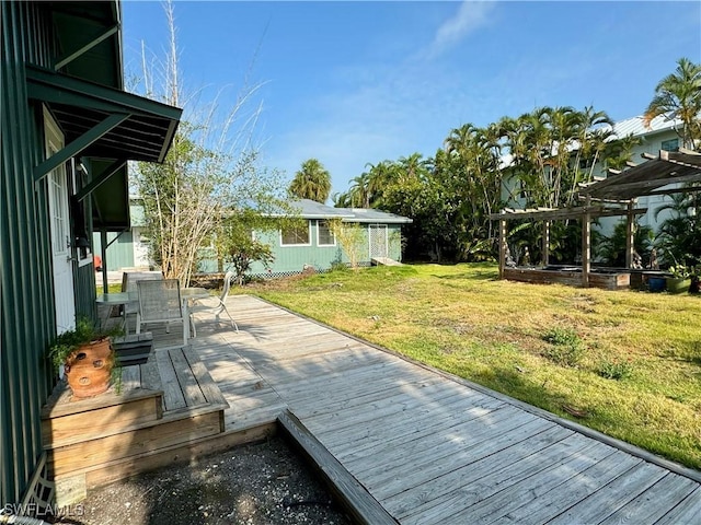 wooden terrace with a yard