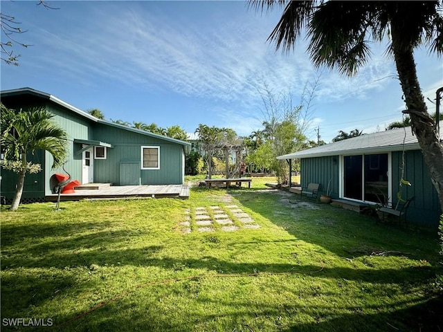 view of yard featuring a wooden deck