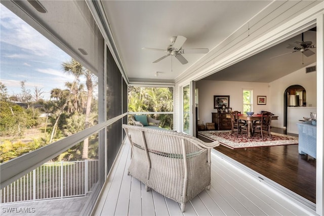 sunroom / solarium with ceiling fan