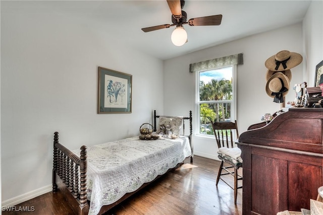 bedroom with dark wood-type flooring and ceiling fan