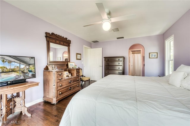 bedroom featuring ceiling fan and dark hardwood / wood-style flooring