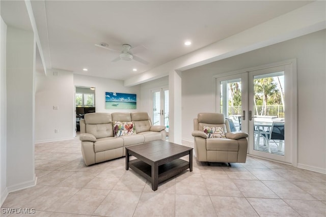 living room featuring light tile patterned floors, plenty of natural light, french doors, and ceiling fan