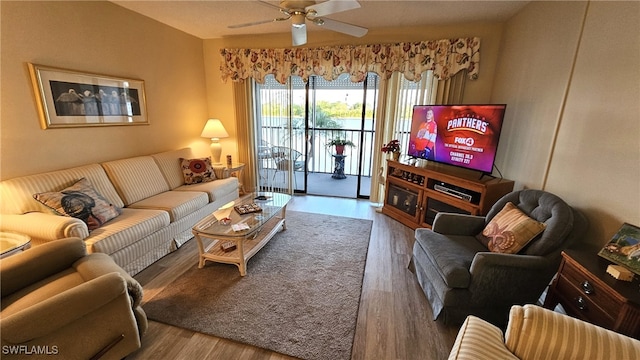 living room with hardwood / wood-style floors and ceiling fan