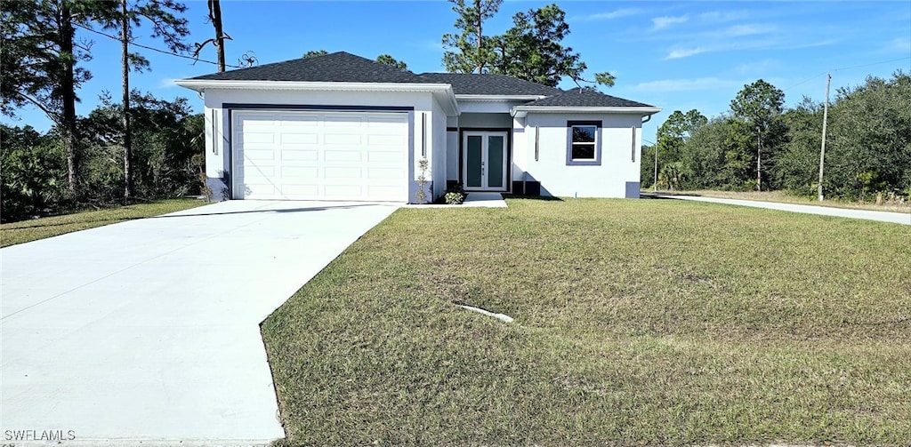 ranch-style home with a garage and a front lawn