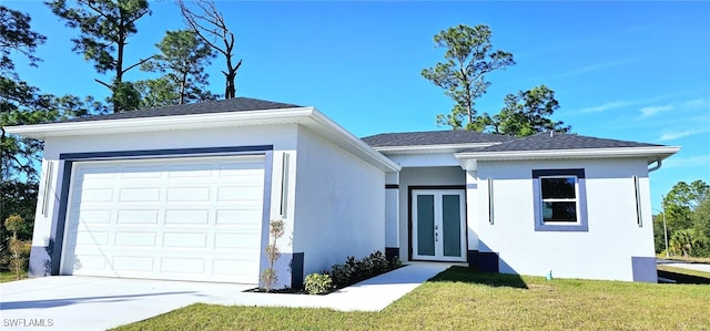 ranch-style house with french doors, a garage, and a front yard