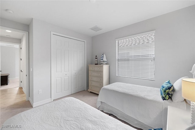 carpeted bedroom with a closet