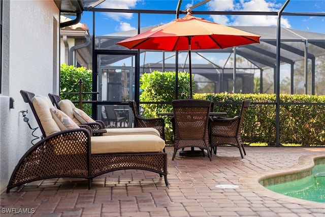 view of patio / terrace featuring a lanai