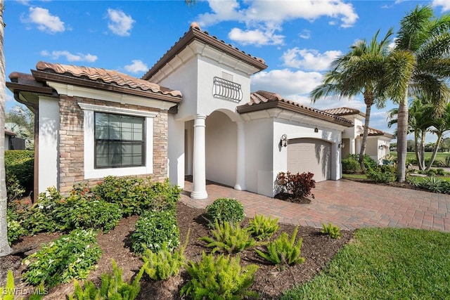 mediterranean / spanish house featuring a garage