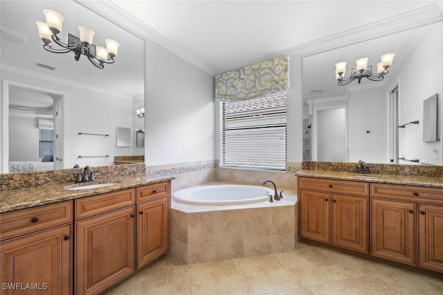 bathroom with tiled bath, ornamental molding, vanity, a notable chandelier, and tile patterned floors