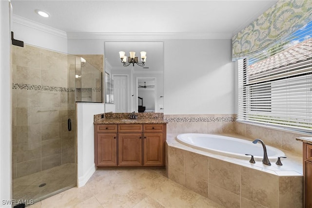 bathroom featuring vanity, ornamental molding, and shower with separate bathtub