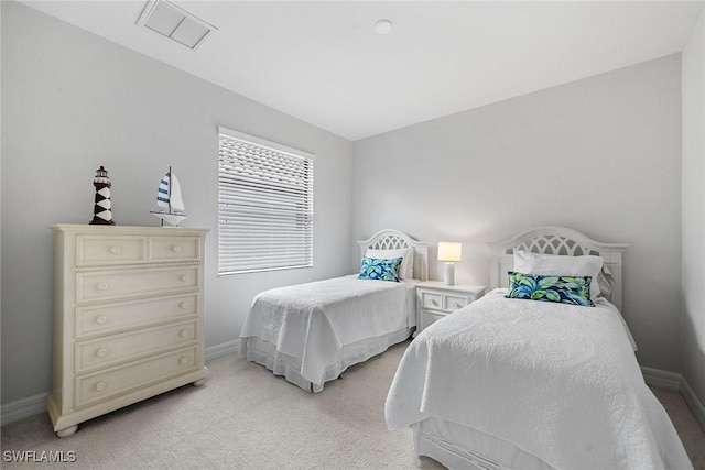 bedroom with light colored carpet