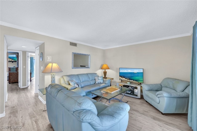 living room featuring crown molding, a textured ceiling, and light hardwood / wood-style flooring