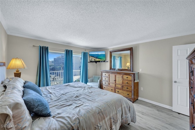 bedroom with crown molding, access to exterior, a textured ceiling, and light wood-type flooring