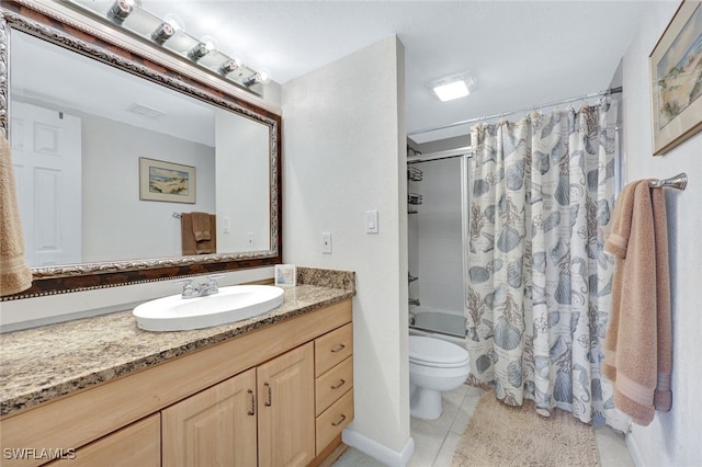 full bathroom featuring vanity, toilet, tile patterned flooring, and shower / bath combo