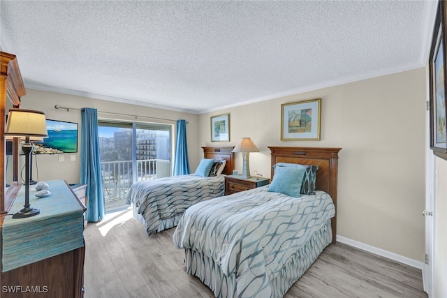 bedroom with crown molding, a textured ceiling, access to exterior, and light hardwood / wood-style floors