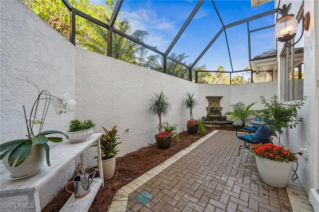 view of patio with a lanai