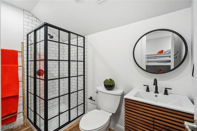 bathroom with vanity, toilet, and vaulted ceiling