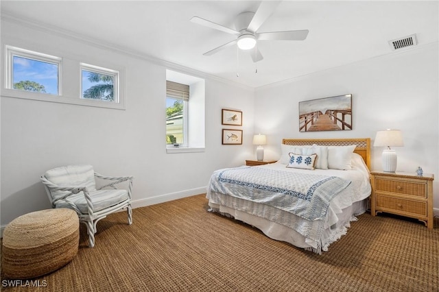 bedroom with carpet floors, ornamental molding, and ceiling fan