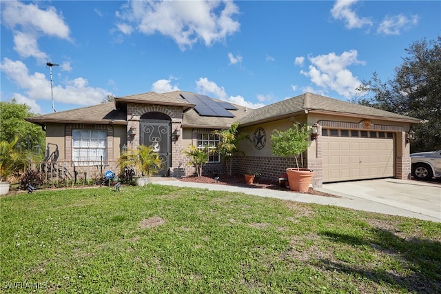 view of front of home featuring a garage, a front lawn, and solar panels