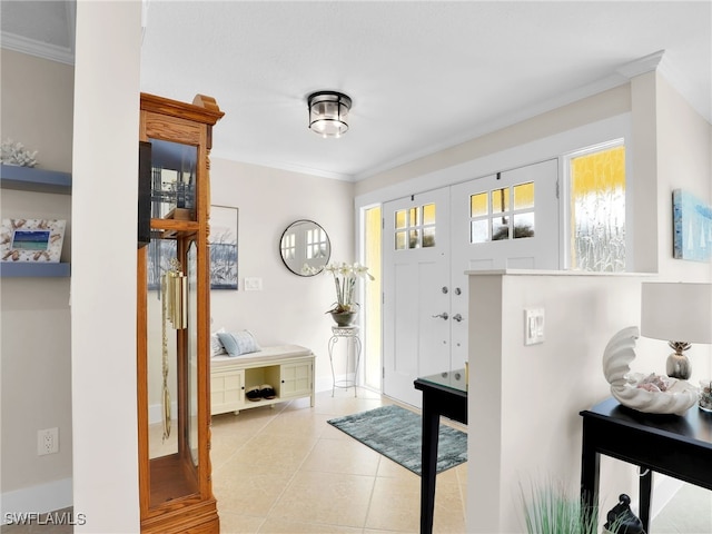 doorway featuring crown molding, plenty of natural light, and light tile patterned floors