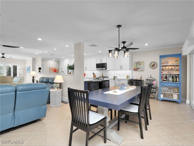 tiled dining space featuring ceiling fan