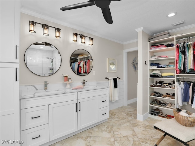 bathroom featuring ornamental molding, vanity, ceiling fan, and walk in shower