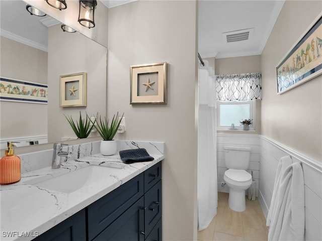 bathroom with ornamental molding, vanity, tile patterned flooring, and toilet