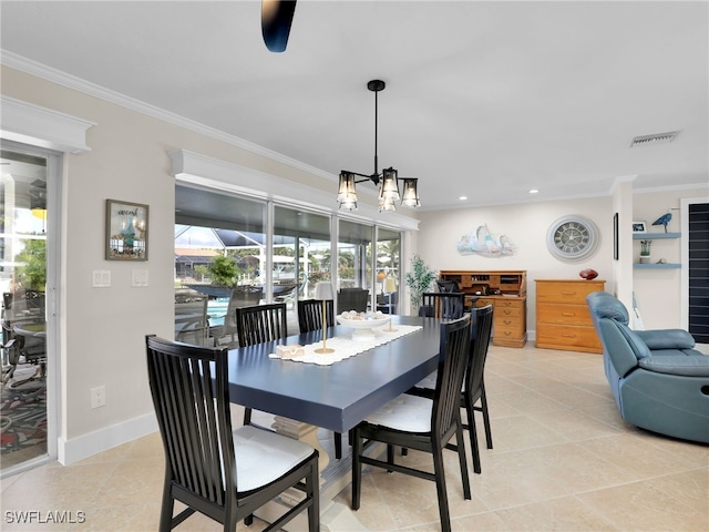 tiled dining area featuring crown molding