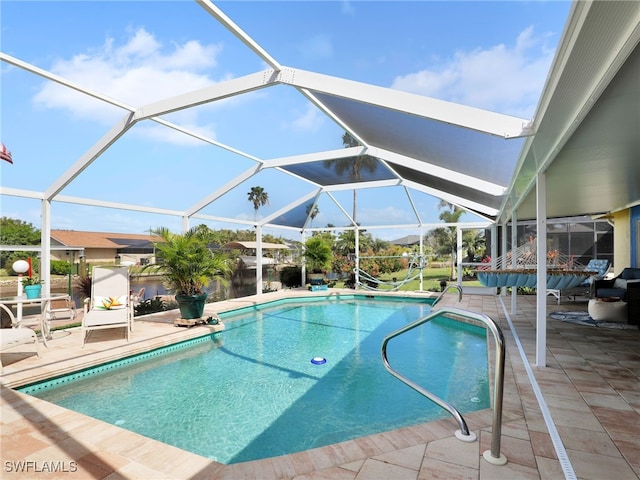 view of pool with a lanai and a patio area