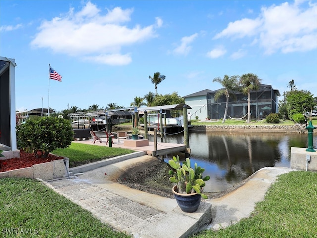 dock area featuring a yard and a water view